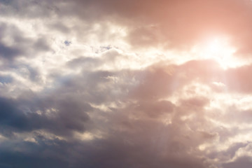 Dark storm clouds in the sky. Blurring background. Bright colors.