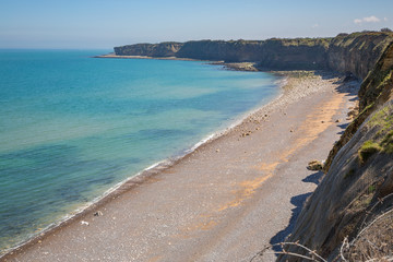 The beach at Pointe du Hoc in Normandy, France - obrazy, fototapety, plakaty