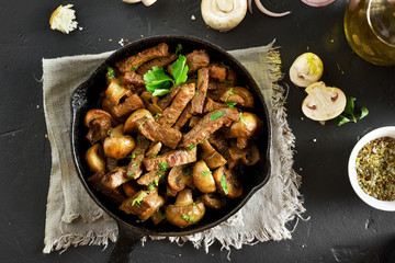 Beef stroganoff with mushrooms in frying pan