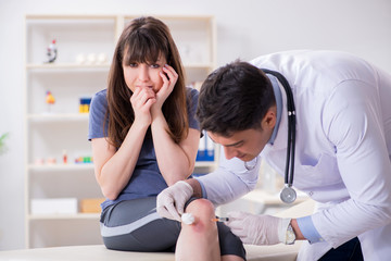 Fototapeta premium Patient visiting doctor after sustaining sports injury