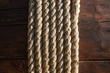 Nautical background. Closeup of an old boat rope.