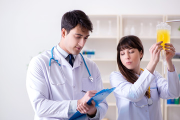 Two doctors discussing plasma and blood transfusion