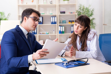 Man signing medical insurance contract