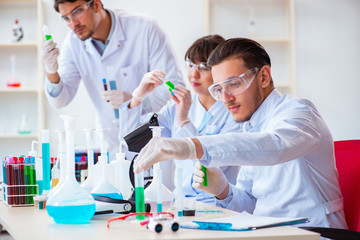 Team of chemists working in the lab