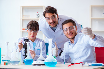 Team of chemists working in the lab