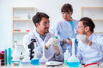 Team of chemists working in the lab