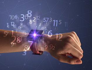 Close up female naked hand wearing smartwatch and numbers around