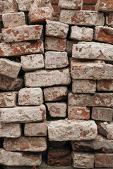 Background of old used bricks of a ruined building texture