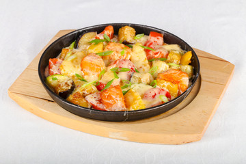 Baked salmon with potato in pan
