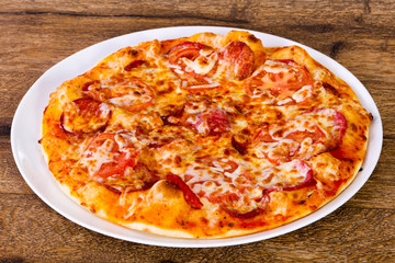 Pepperoni pizza with sausages