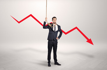 Desperate young businessman with decreasing bankruptcy concept
