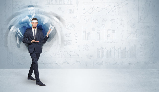 Young businessman in suit fighting with chart and report concept
