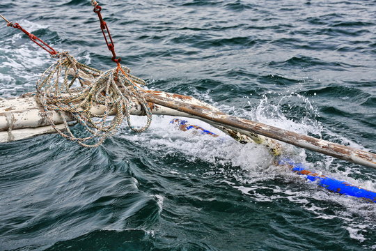 Bamboo outrigger projecting from a Filipino bangka boat-N.Bays Bay-Negros Oriental-Philippines.0535