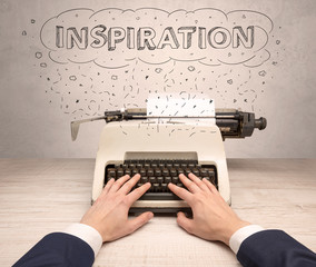 First person perspective hand writing on typewriter with cloud message concept
