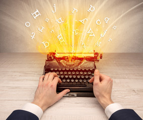 First person perspective image with exploding letters from a vintage typewriter concept

