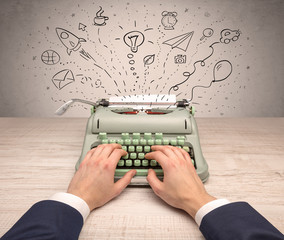 Typewriter with doodles, idea, message, plane, car balloon social media concept
