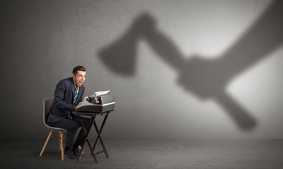 Shadow threatening hard worker man who is afraid
