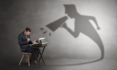 Hard working businessman shadow yelling to himself concept
