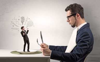 Big boss eating small businessman with knife and fork
