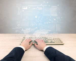 Elegant businessman hand typing with financial, report, graph, chart concept
