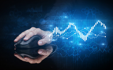 Hand using wireless mouse with statistical concept on dark background
