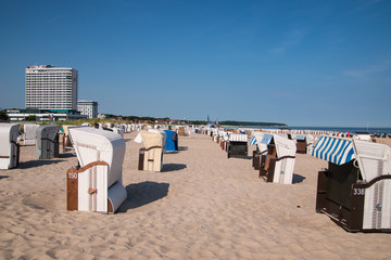Closed beach chair huts on white sand beach in Warnemunde Germany