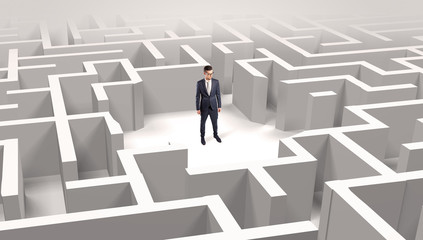 Young businessman standing in a middle of a 3D maze
