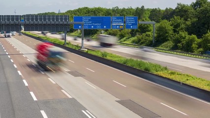Traffic jam on german highway autobahn A5 near Frankfurt Airport with cars, trucks, busses and traffic signs - time lapse, Frankfurt Airport, Germany, May, 30th, 2018