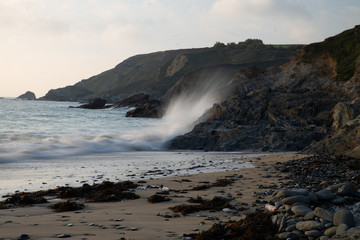 Waves crashing on rock