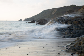 Waves crashing on rock