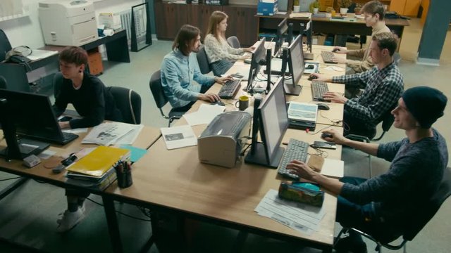 Group of Students is Studying and Working at Computers at the University in IT Education Room
