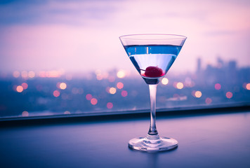 Martini drink and city view. 