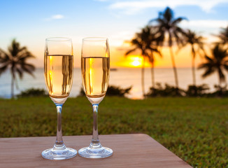 Champagne drinks in a beautiful sunset setting.