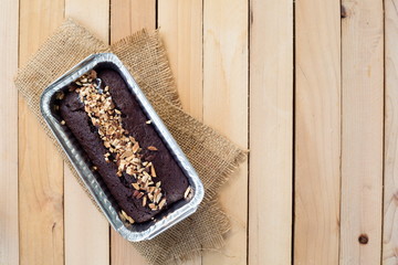 Chocolate cake in aluminum foil box packaging with copy space,Top view.