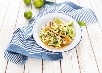 Homemade Tacos Served on Plate with Lime and Fresh Radishes