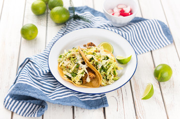 Homemade Tacos Served on Plate with Lime and Fresh Radishes