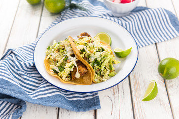 Homemade Tacos Served on Plate with Lime and Fresh Radishes