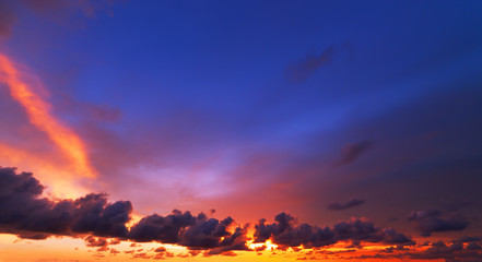 Colorful color of dramatic sky and clouds in the sunset.