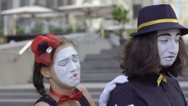 Young girl mime pity her boyfriend