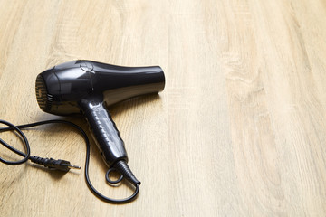 Hair dryer on wooden