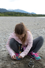 Young girl playing on the beach