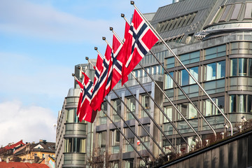 Norwegian flags floating on building