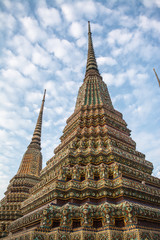 Fototapeta premium Pagoda is in Wat Pho that was named as the temple of the pagoda or chedi that are decorated with yellow glaze or glazed tiles or dark blue. 