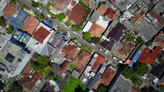 Overhead aerial shot of low-rise buildings, grid structure in Jakarta city, Indonesia