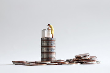 A miniature woman who works in a kitchen and a pile of coins.