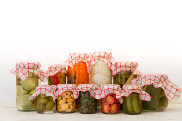 variety of jars with organic vegetable pickles