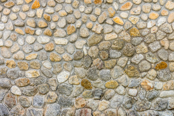 Defensive round stone wall. It is constructed with natural rock and mortar.