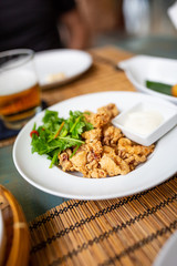Fried calamari for lunch in Jimbaran Bay, Bali
