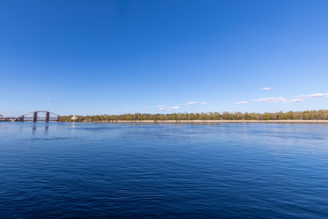 Obraz premium View with blue deep river and horizon line