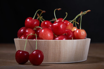 cherries ripe red fruit harvest vitamins wooden bowl